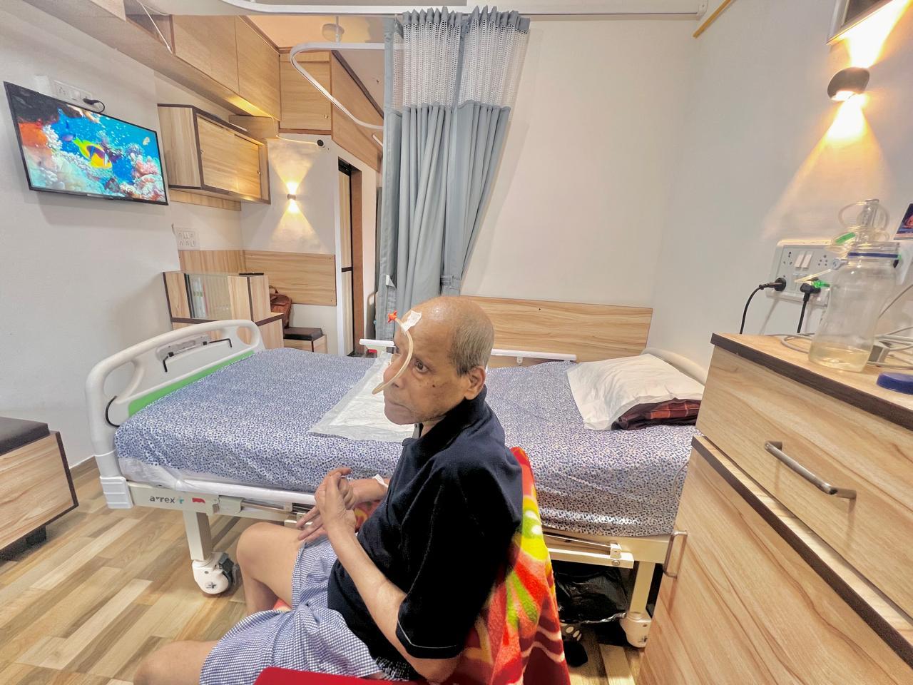 Private patient care room with TV and amenities